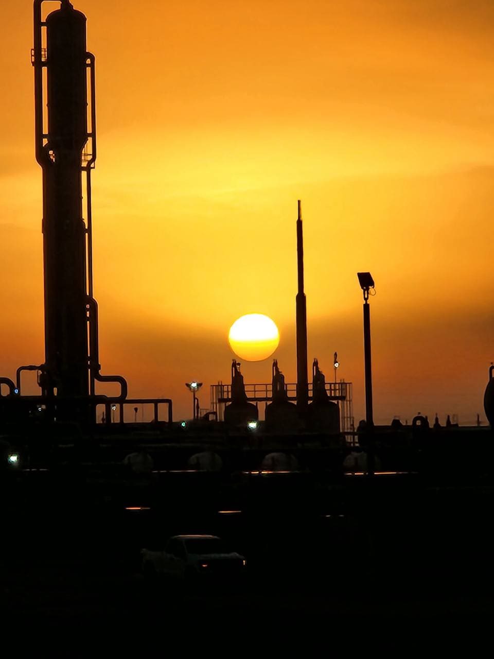 Sunset over one of our fuel facilities with a delivery truck on site